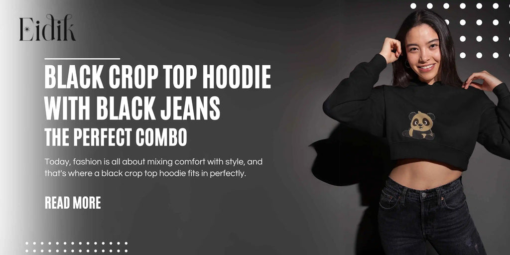 Young woman wearing a black crop top hoodie with a cute panda design, paired with black jeans, smiling and posing confidently against a dark background. Eidik fashion banner promoting black crop top hoodie with black jeans as the perfect combo.