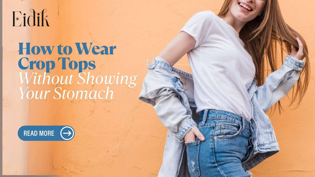 Smiling woman wearing a white crop top, denim jeans, and a light denim jacket against an orange wall — Eidik guide on how to wear crop tops without showing your stomach.